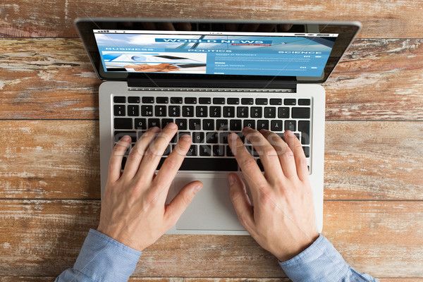 7629837_stock-photo-close-up-of-male-hands-with-laptop-typing.jpg